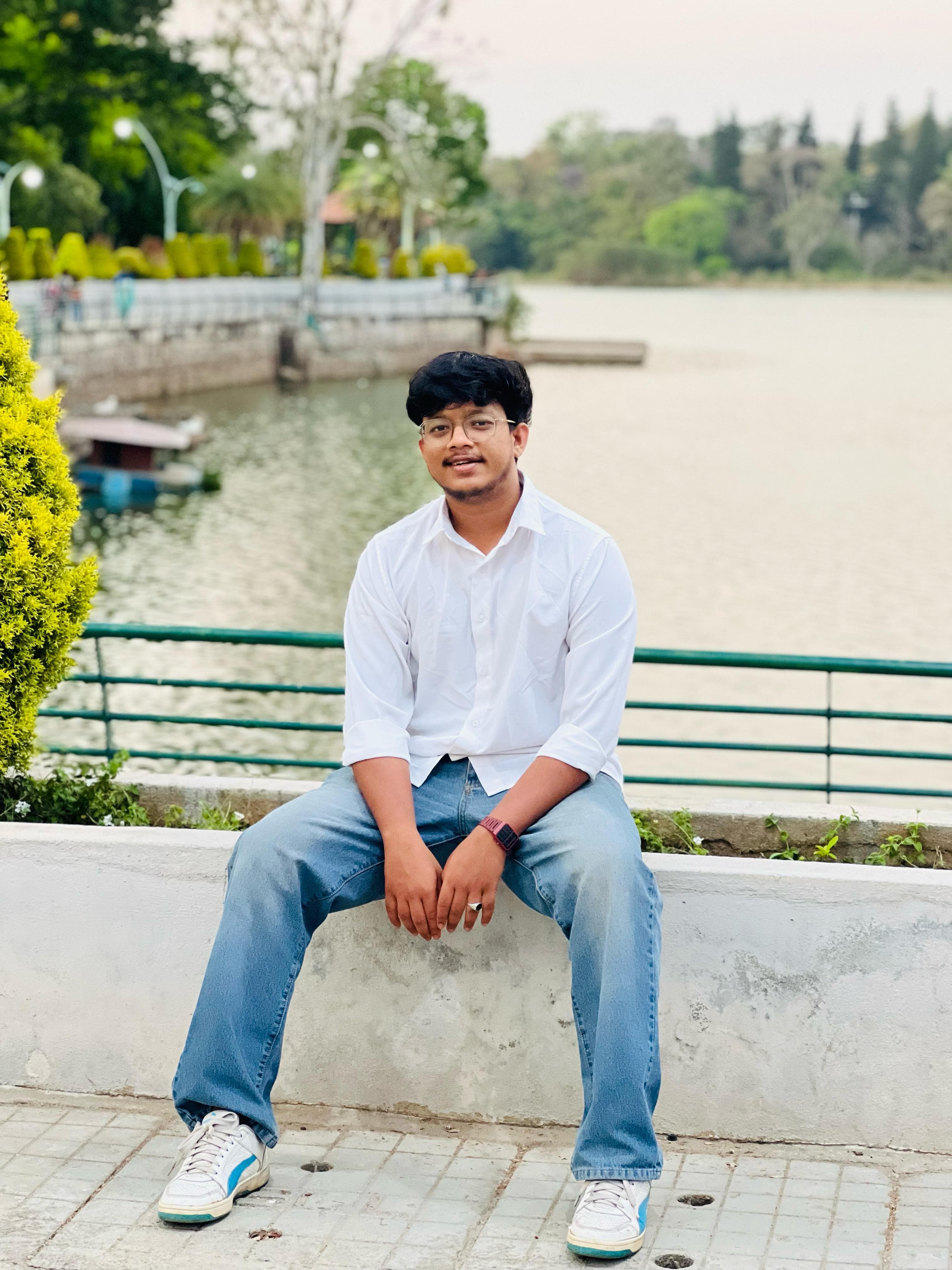 Gogul Krishna sitting by a lake in Bangalore